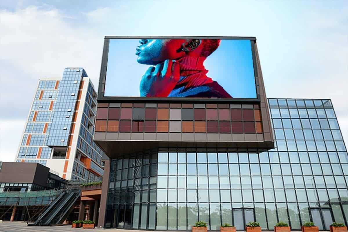 Large outdoor LED advertising display on a modern commercial building